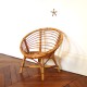 Fauteuil en rotin corbeille